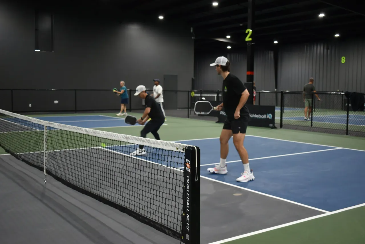 Players and guests sharing the indoor courts at Concord Pickleball